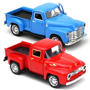 Macro detail of classic vintage alloy pickup truck models in blue and red finishes