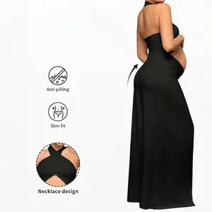 Slim fit black maternity maxi dress with cross halter neck and elegant cutout design