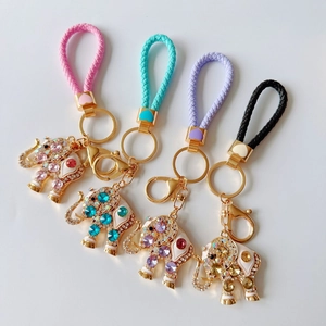Colorful elephant keychains with rhinestone inlay and braided leather cords in four colors