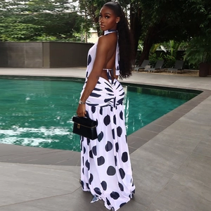 Polka dot backless halter maxi dress for women with high-slit and flowing skirt