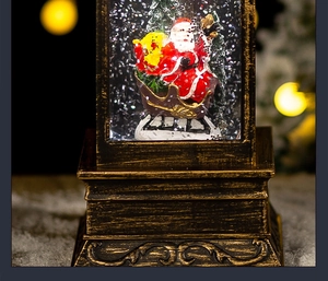 Detailed view of bronze Christmas lantern featuring Santa sleigh and warm bokeh lights