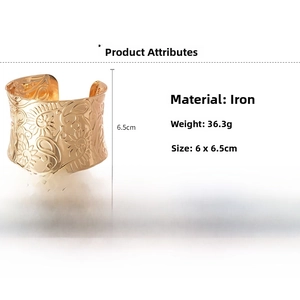 Detailed view of golden iron wide cuff bracelet featuring embossed floral pattern and dimensions