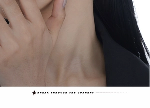 Fashionable model in black suit showing stylish ear cuff accessory with minimalist vibes