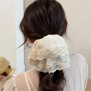 Elegant off-white lace bow scrunchie with intricate embroidery for women hair ties