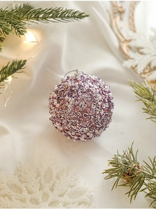 Macro detail of 8cm pink Christmas ball with sparkling sequins and pearl beads