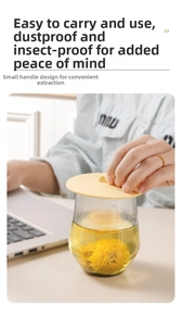 Close-up of yellow silicone cup cover with handle on glass cup for dust protection