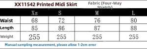 Detailed size chart for printed midi skirt showing waist and length measurements