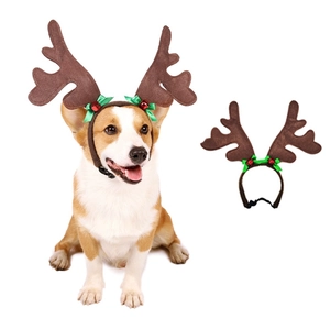 Detail of Christmas reindeer antler headband with bell and bow for dogs and pets
