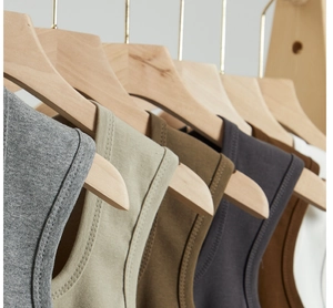 Detailed close-up of knit cotton tank top collar with double-stitched neckline and texture