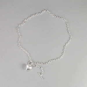 Silver 925 heart pendant necklace with toggle clasp and link chain on grey background