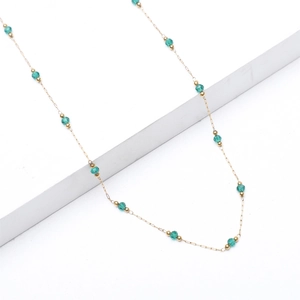 Elegant 18K gold plated stainless steel necklace with green crystal beads on white block
