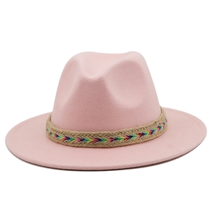 Detailed view of pink wool felt jazz hat featuring a colorful woven band and wide brim
