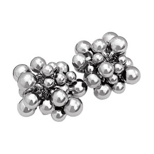 Macro shot of silver beaded earrings with high-polished metallic clusters and smooth texture