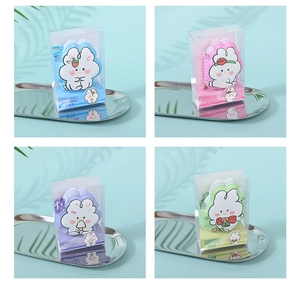Collage of four squishy rabbit notebooks in blue, pink, purple, and green PVC packaging