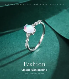 Macro detail of s925 silver ring featuring an oval moonstone and sparkling side stones