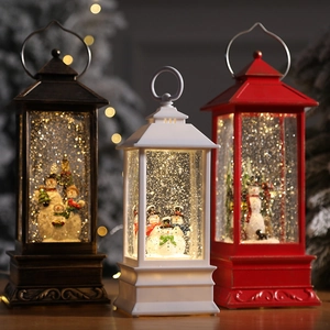 Christmas musical snow lantern with snowman scenery in bronze, white, and red finishes