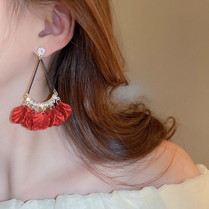 Fashion red flower petal drop earrings with crystals worn by a female model