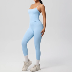 Side view of light blue high-waist yoga set with sports bra and leggings for women