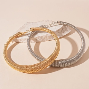 Exaggerated metal circle choker necklace with spiral texture in gold and silver finish