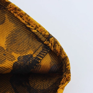 Golden vintage jacquard backless dress with high collar and intricate floral textures