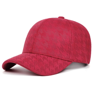 Detail view of burgundy baseball cap with premium houndstooth texture and 6-panel design