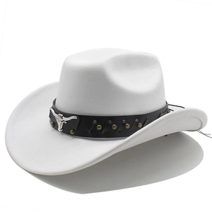 Detail of silver bull head ornament and metallic rivets on a white suede cowboy hat
