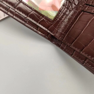 Detailed interior of crocodile texture wallet with card slots and a clear photo window