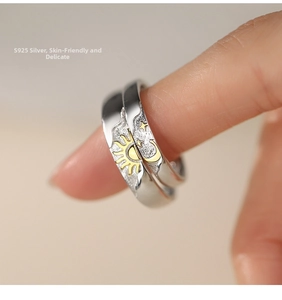 Close-up of S925 sterling silver sun and moon couple rings with gold detailing