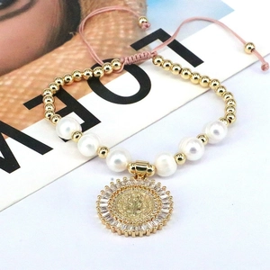 Handmade pearl bracelet with zircon religious medal and pink adjustable woven cord