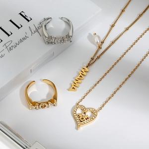 Silver and gold MOM rings with matching MAMA pearl and heart pendant necklaces set