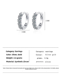 Detailed view of 15mm round earrings with green zircon inlay and product dimensions