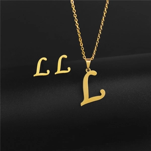 Detailed view of golden stainless steel jewelry set with letter L pendant and earrings