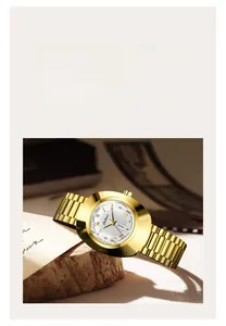 Detail of gold vintage watch with day-date display and polished metal link bracelet