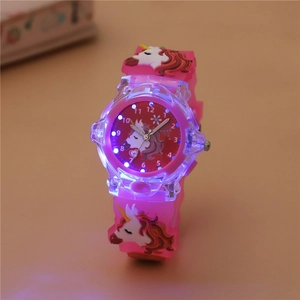 Detail of pink unicorn kids watch with glowing LED lights and 3D silicone strap design