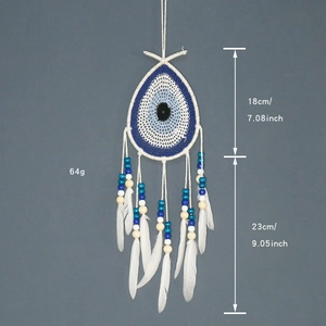 Bohemian Evil Eye dreamcatcher with blue feathers and beads, wall decor dimensions shown