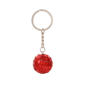 Close-up of a red disco mirror ball keychain with metallic ring on white background