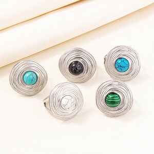 Detail of vintage bohemian silver rings with turquoise and marble stone inlays