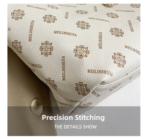 Detailed close-up of precise stitching and pebble grain texture on white tote bag