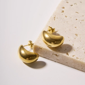 Polished 18k gold plated stainless steel hollow geometric earrings on stone base
