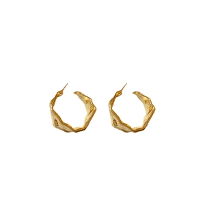 Chic gold C-shaped earrings with a modern wavy textured metal design for women