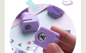 Close-up of purple bear shaped paper puncher with metal blade for DIY scrapbooking