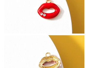 Macro view of lip charms in red enamel with crystals and textured gold plating