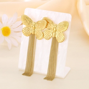 Elegant gold stainless steel butterfly earrings with long tassel chains on silk background