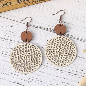 Retro geometric hollow wood disc earrings with matte finish and ethnic bohemian style