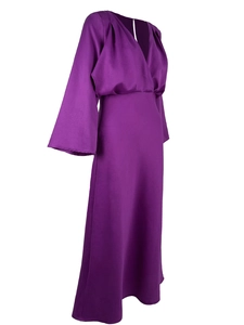 Detail view of purple silk dress with deep V-neck and long sleeves on white background