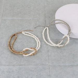 Minimalist double layer necklace with mixed faux pearls and metallic beads in knotted design