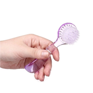 Ergonomic purple nail cleaning brush with dense white bristles for professional manicure care