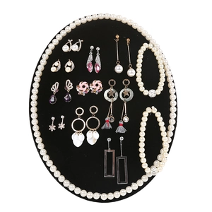 Oval velvet wall hanging organizer for earrings, pearl bracelets and necklaces