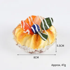 Realistic fake fruit cake model with orange and berries for photography props