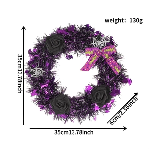Detailed view of Halloween wreath with black roses, purple sequins, and spider web accents
